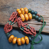 Handcrafted vintage jewelry necklace featuring exquisite amber resin and glass beads, weighing 333 grams. Perfect for adding a touch of timeless elegance to any ensemble